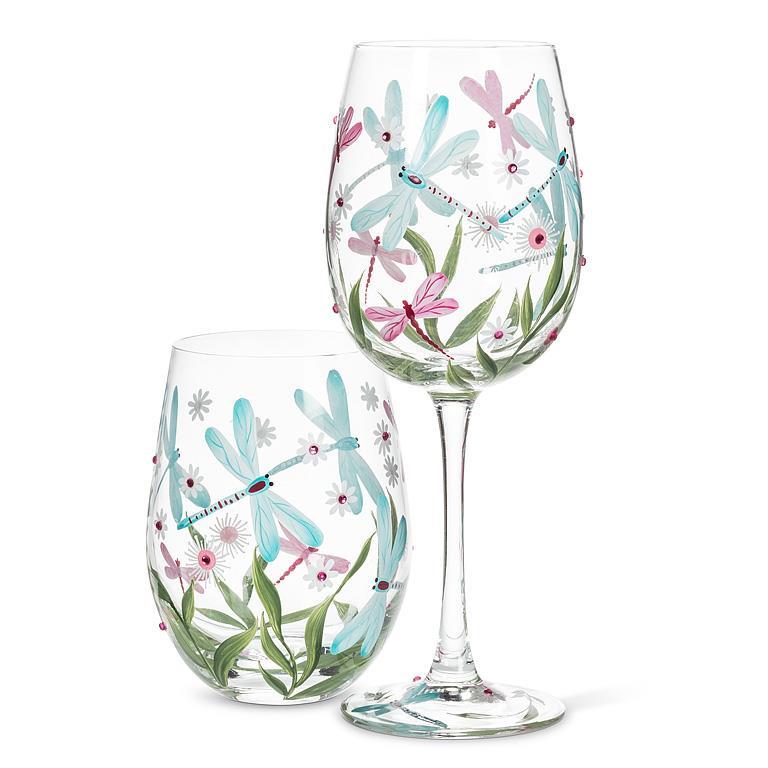 Ensemble de deux verres transparents assortis, un verre sans pied et un verre à pied, décorés d'illustrations bucoliques de libellules et de fleurs champêtres.
