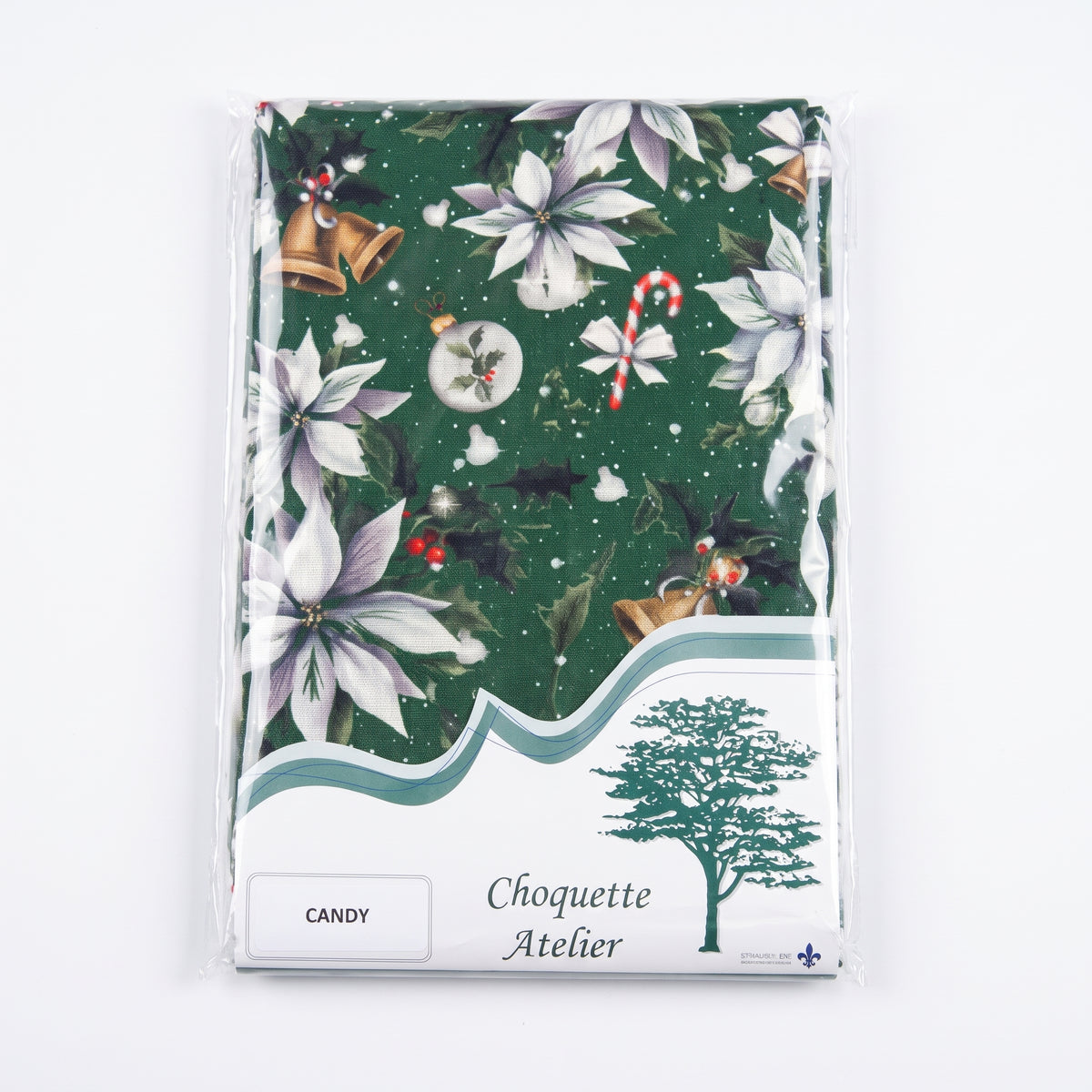 Nappe de Noël pliée sous emballage plastique, marque Choquette Atelier, modèle Candy à fond vert orné de poinsettias blancs, de cloches dorées et de sucres d'orge