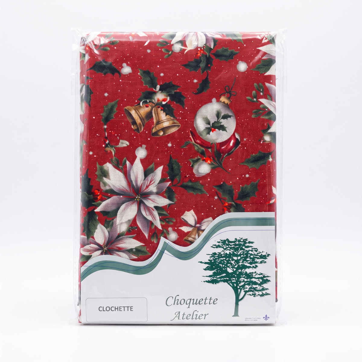 Nappe de Noël pliée sous emballage plastique, marque Choquette Atelier, modèle Clochette à fond rouge avec motifs de cloches dorées, poinsettias blancs et houx.